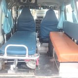 Inside the Maruti Eeco ambulance — wheeled stretcher and attendant bench