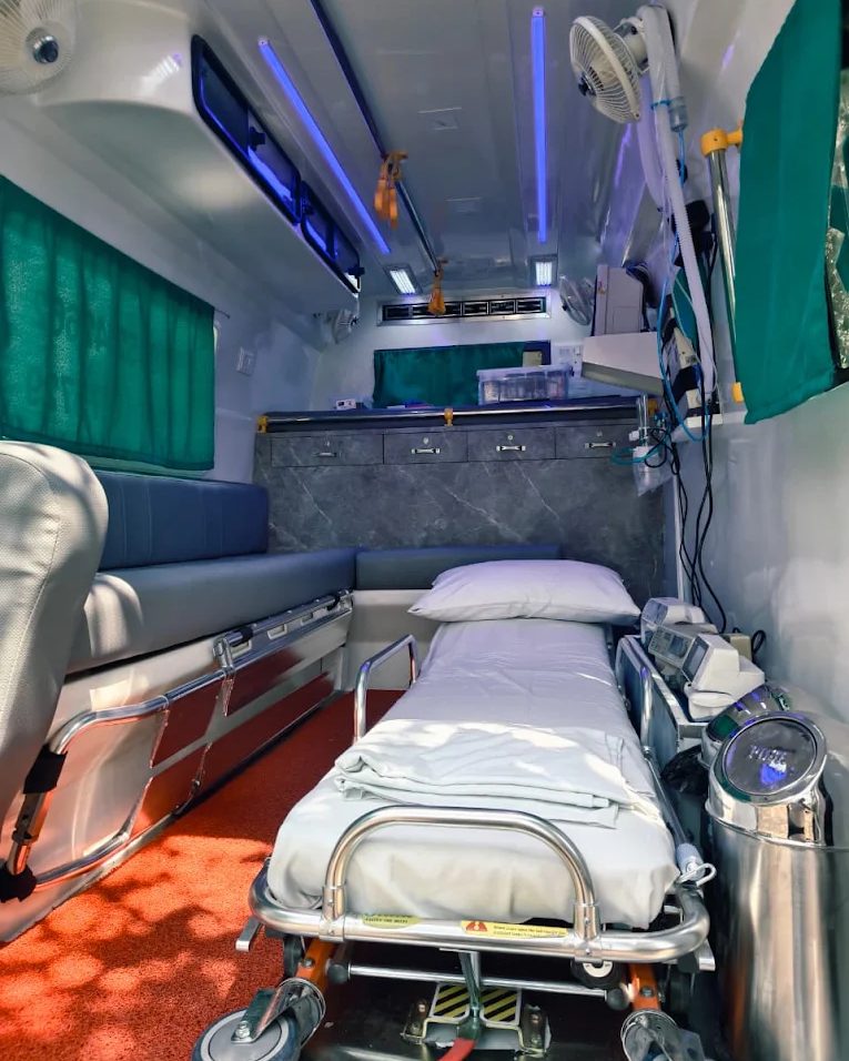 Inside the R.N Ambulance Service ICU setup ambulance — stretcher, cabinets and oxygen line